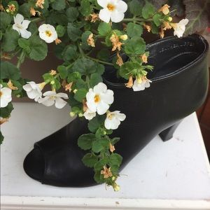 Black leather open toe bootie.